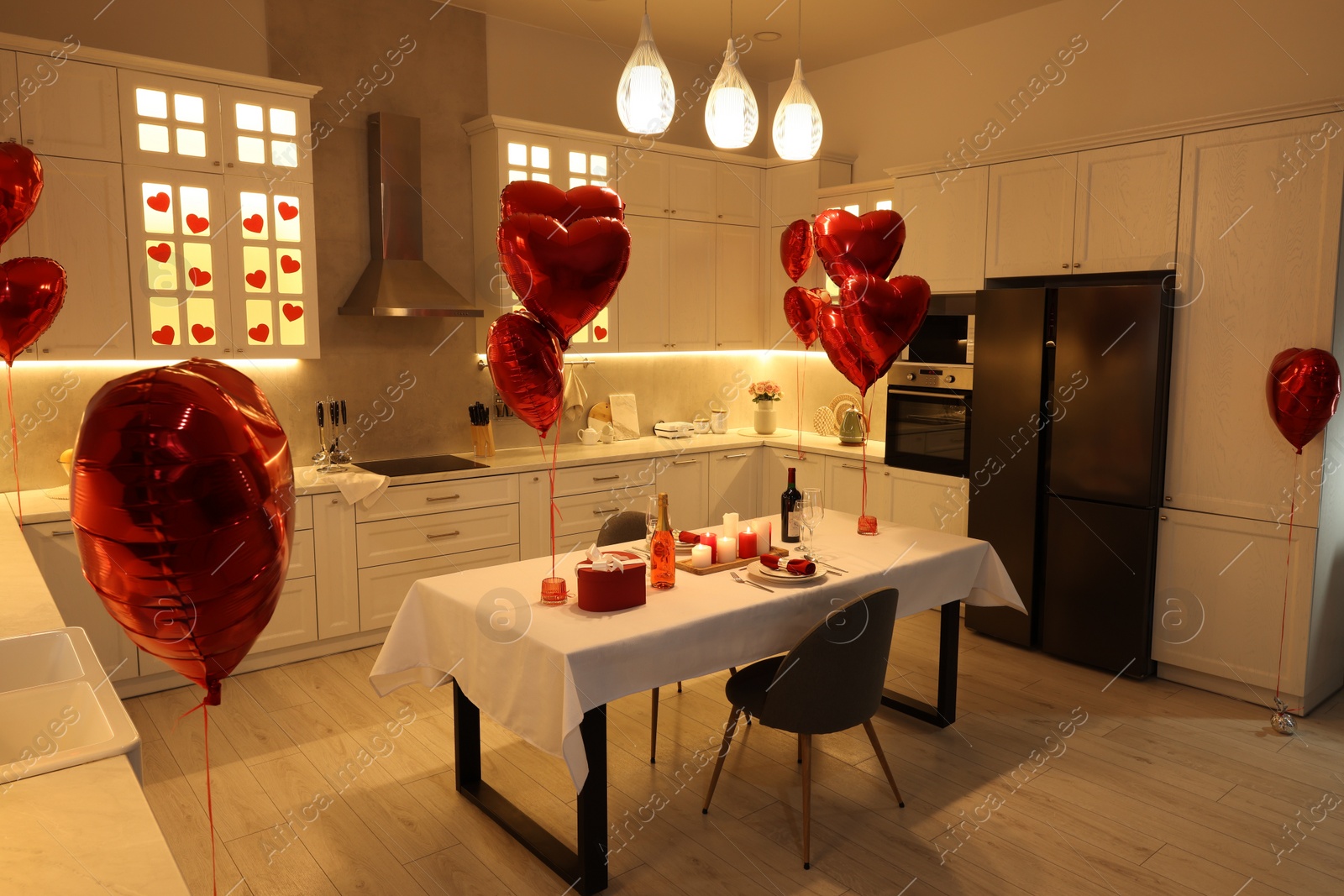 Photo of Romantic atmosphere. Cosy kitchen with set table decorated for Valentine day