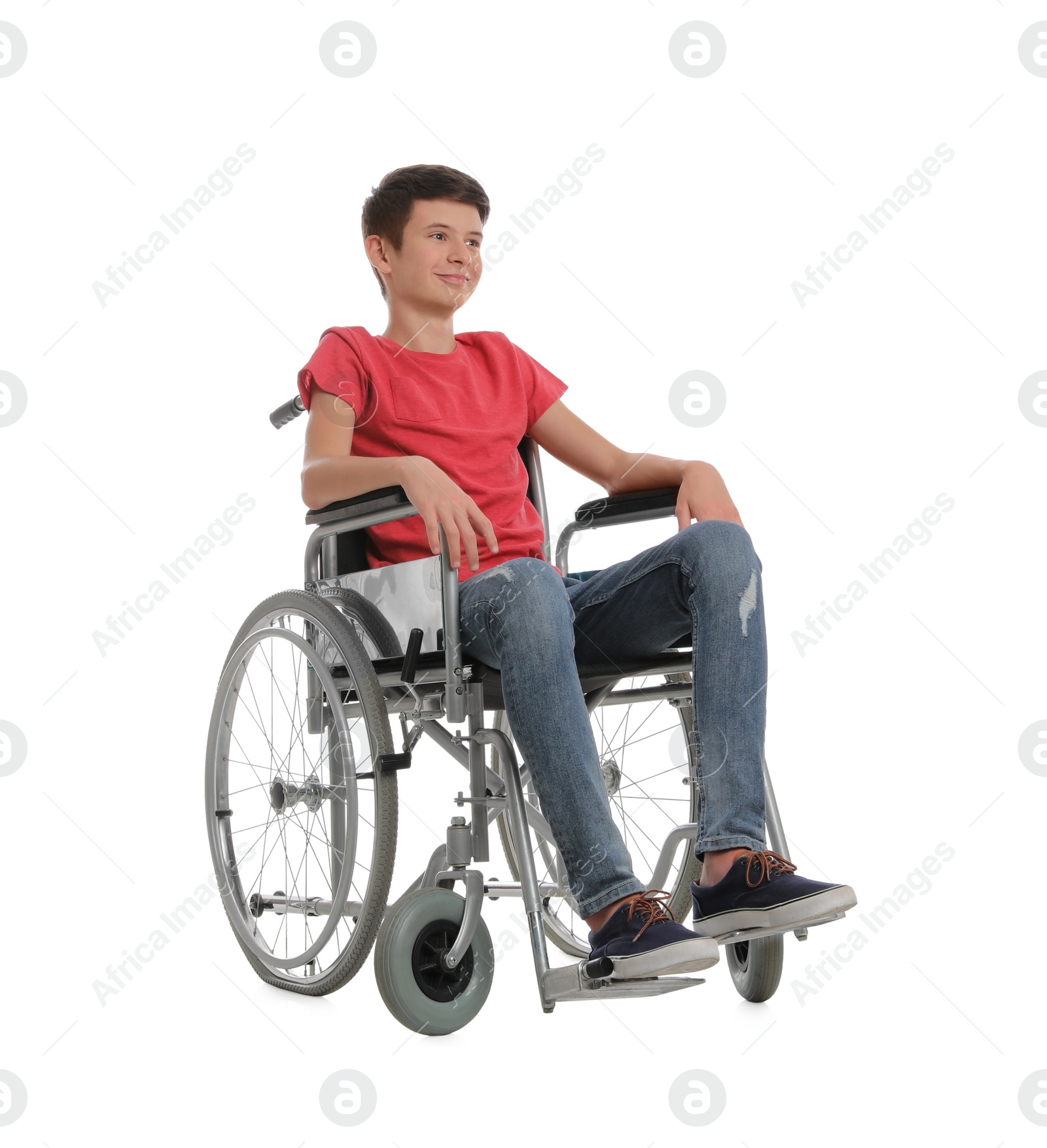 Photo of Teen boy in wheelchair on white background