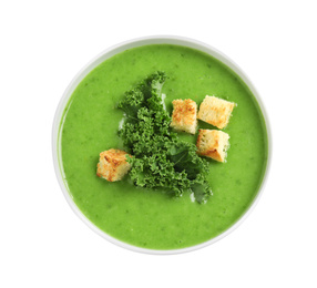 Photo of Tasty kale soup with croutons isolated on white, top view