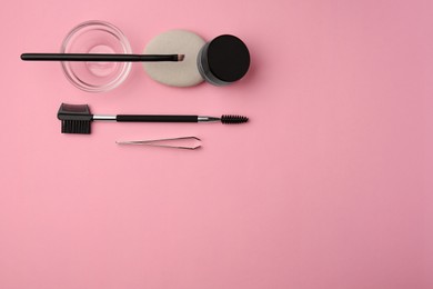 Eyebrow henna and professional tools on pink background, flat lay. Space for text