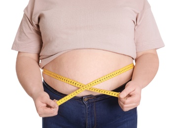 Overweight woman measuring waist with tape isolated on white, closeup