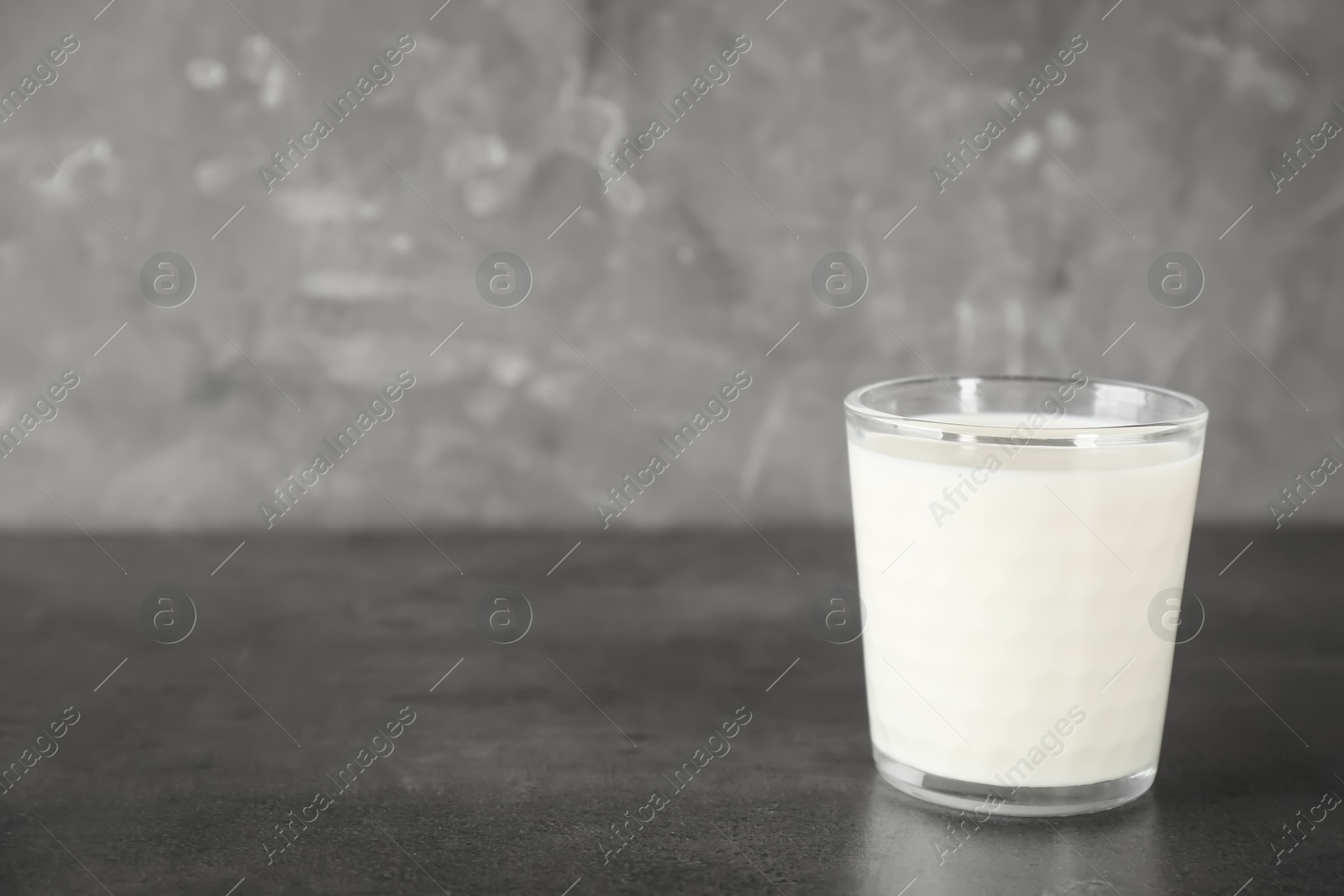 Photo of Glass of milk on table. Fresh dairy product