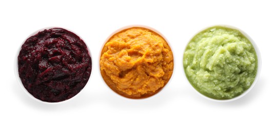 Photo of Different delicious puree in bowls on white background, top view. Healthy food