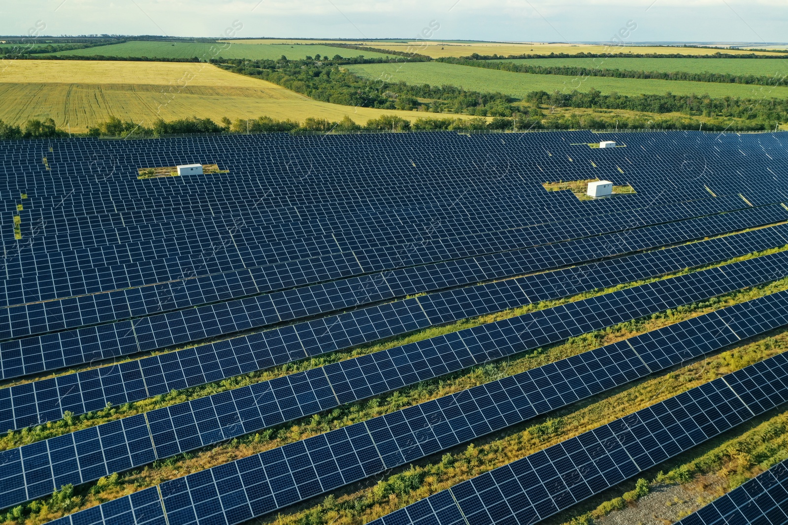 Photo of Solar panels installed outdoors, aerial view. Alternative energy source