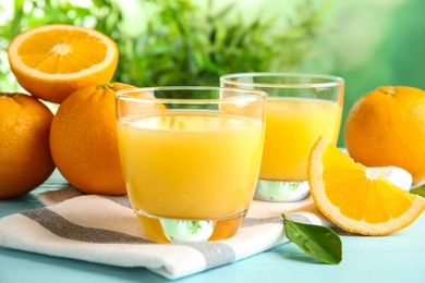 Photo of Composition with orange juice and fresh fruit on table