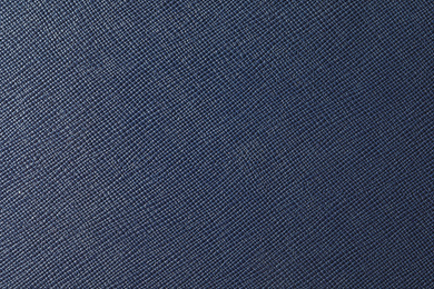 Photo of Texture of dark blue leather as background, closeup