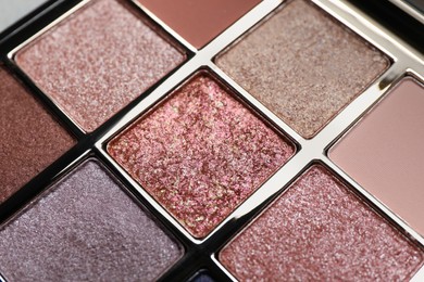 Photo of Beautiful eye shadow palette with different shades, closeup