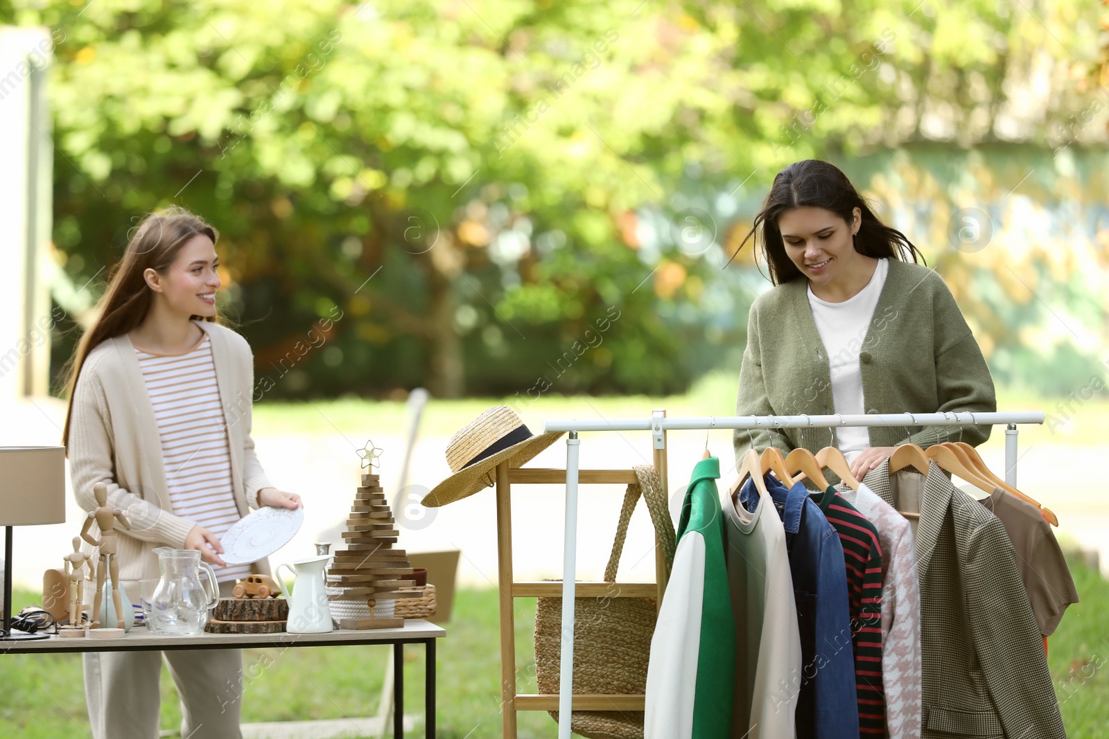 Photo of Women shopping on garage sale in yard