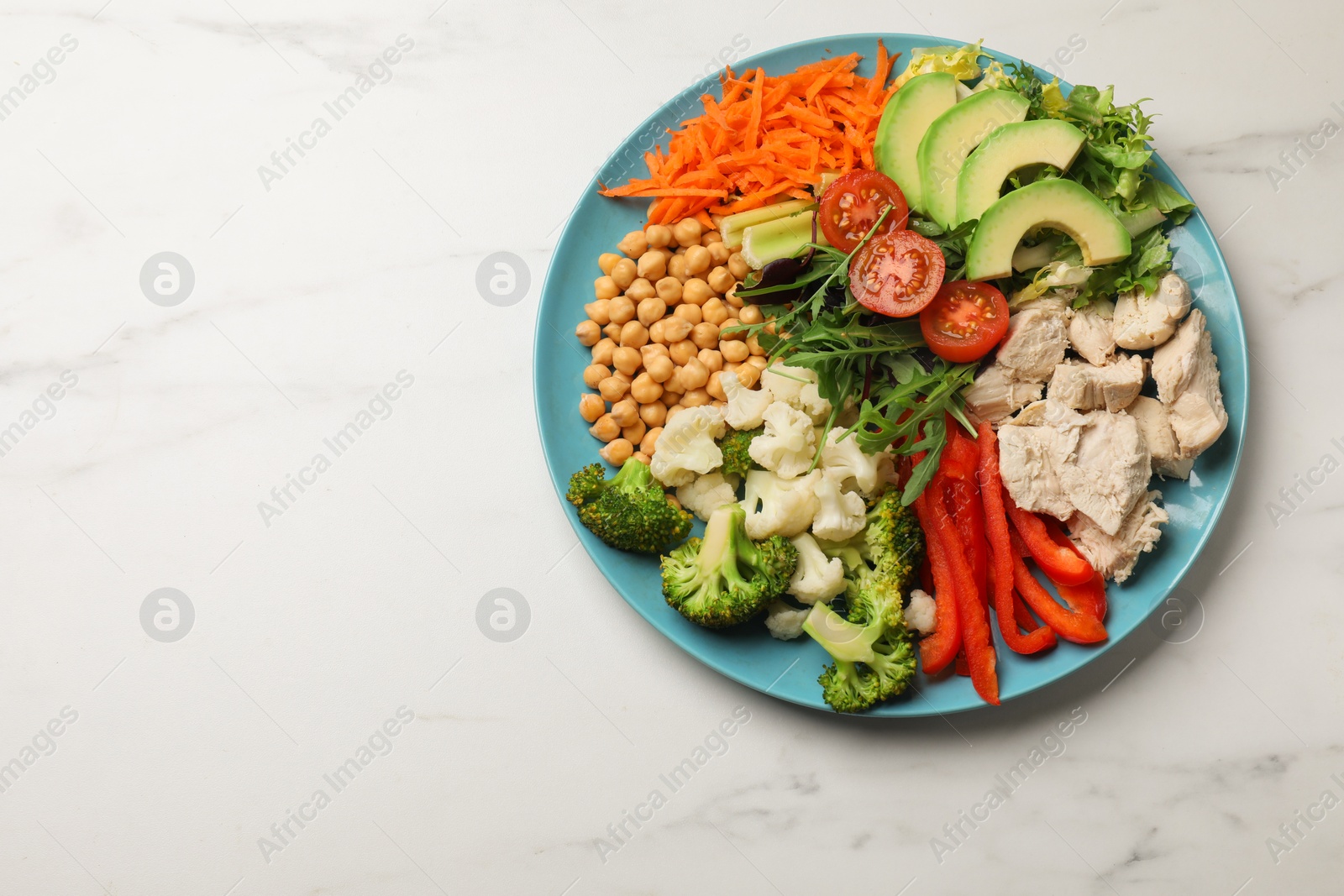 Photo of Balanced diet and healthy foods. Plate with different delicious products on white marble table, top view. Space for text