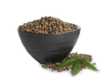 Bowl with hemp seeds and leaf on white background