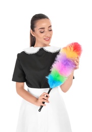 Photo of Young chambermaid with dusting brush on white background