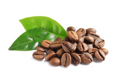 Photo of Roasted coffee beans and fresh green leaves on white background
