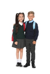 Photo of Little children in stylish school uniform on white background