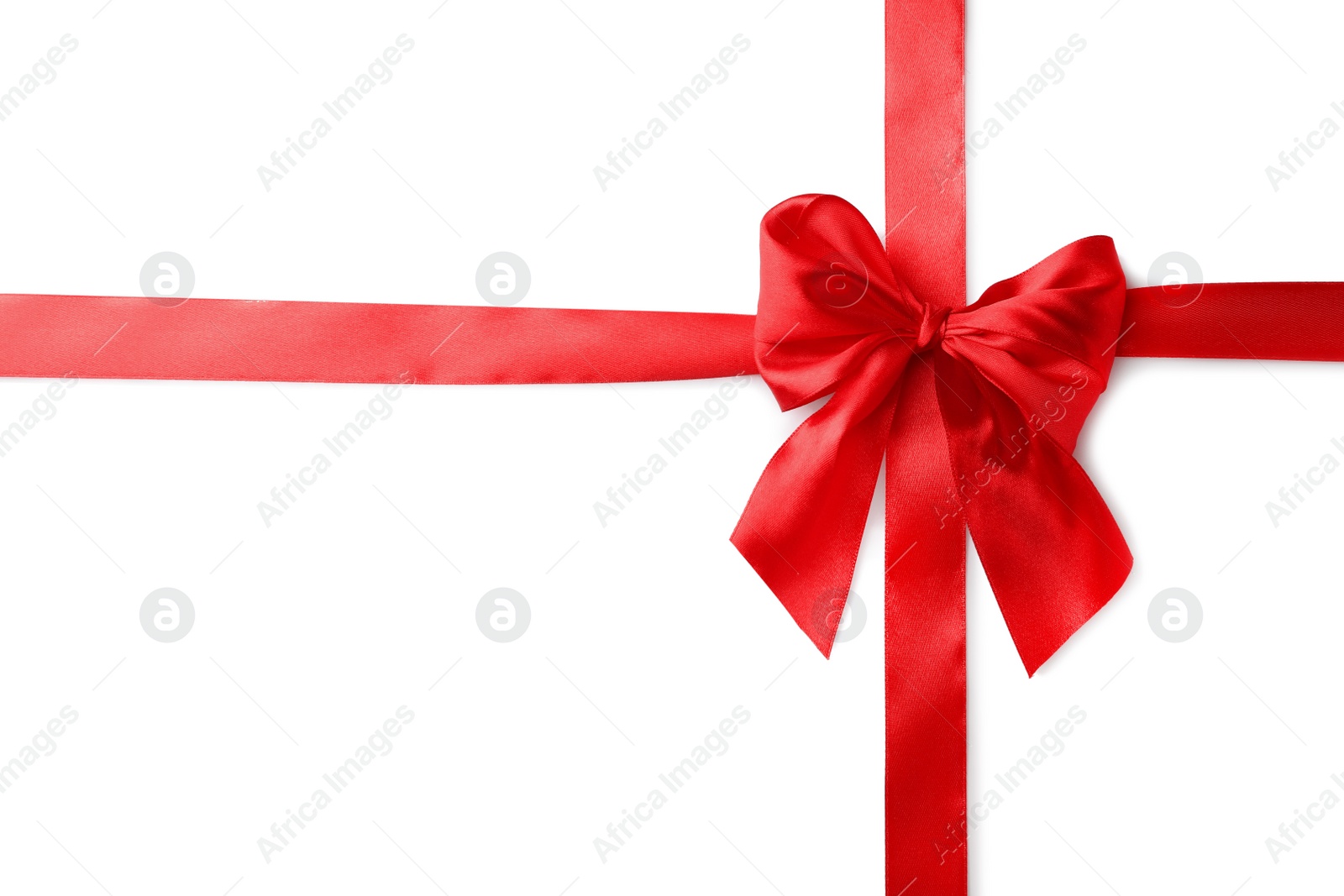 Photo of Red bow and ribbon on white background, top view