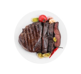 Photo of Delicious grilled beef meat with vegetables isolated on white, top view