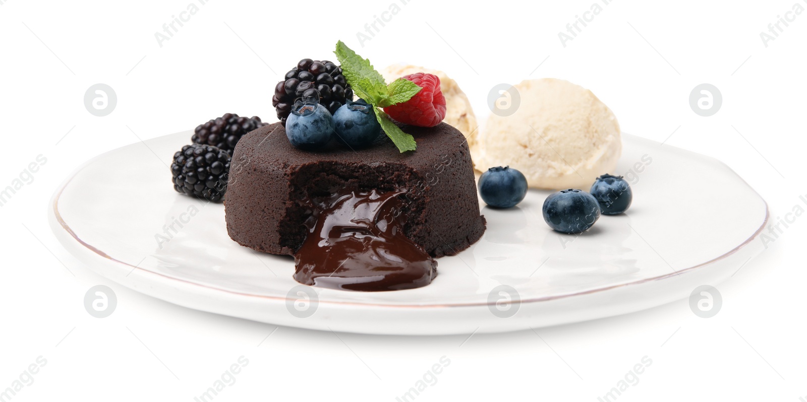 Photo of Plate with delicious chocolate fondant, berries, mint and ice cream isolated on white