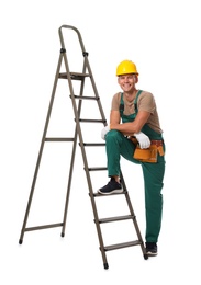 Photo of Professional constructor near ladder on white background