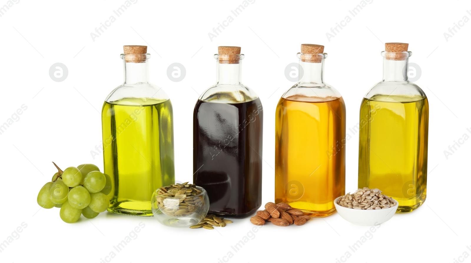 Photo of Vegetable fats. Bottles of different cooking oils and ingredients isolated on white