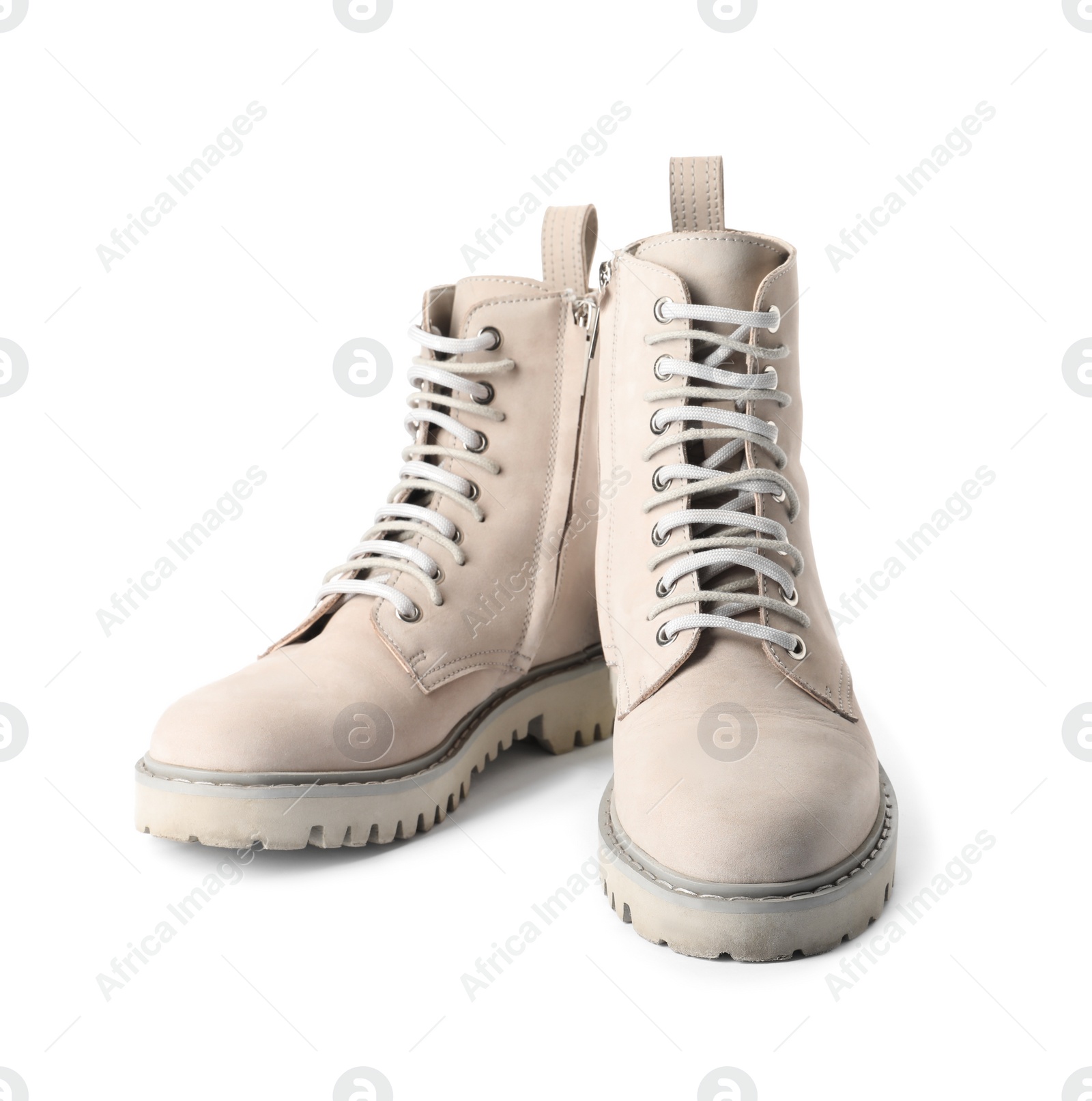 Photo of Pair of stylish boots on white background