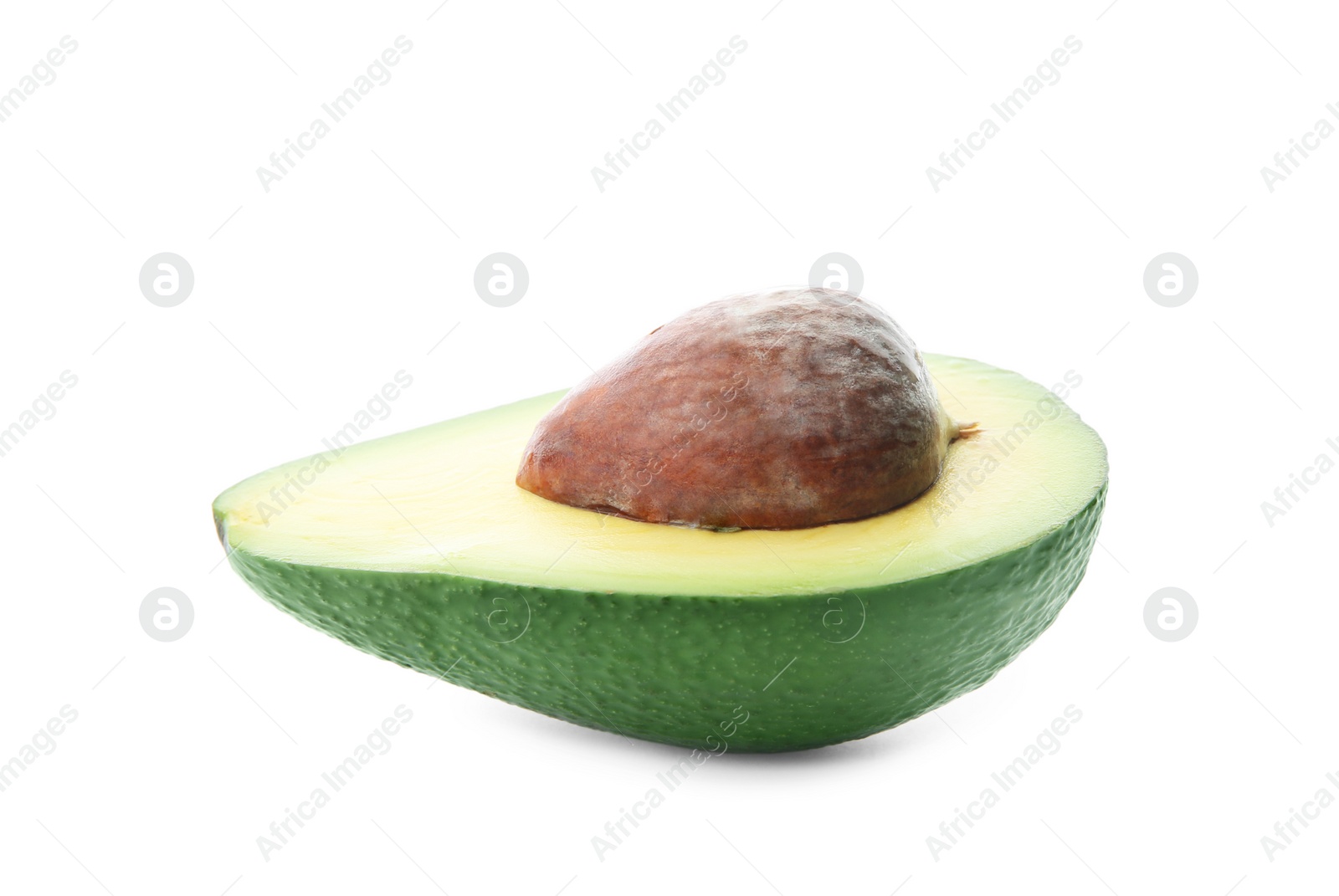 Photo of Half of ripe avocado with pit on white background