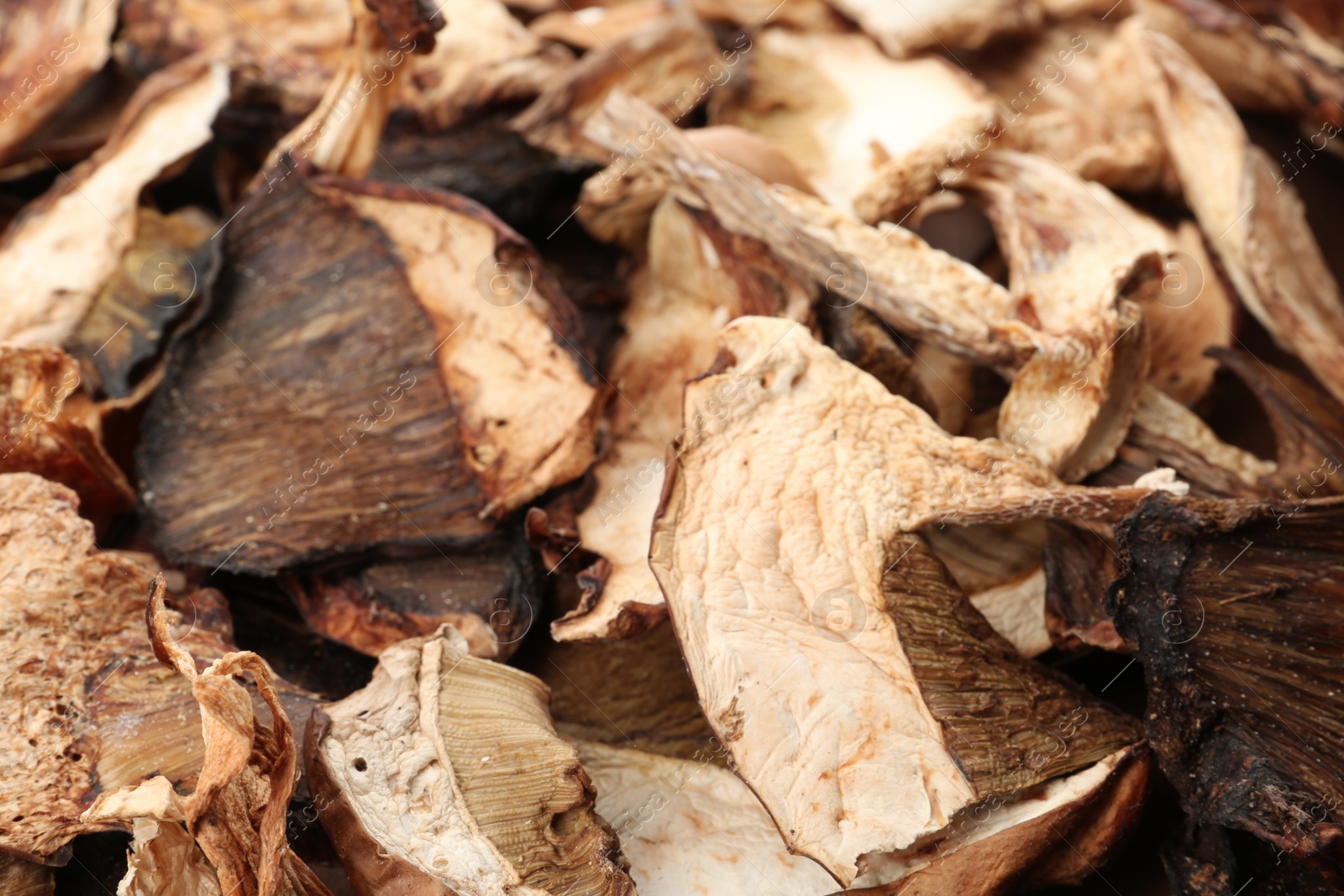 Photo of Delicious dried slices of mushrooms as background, closeup view