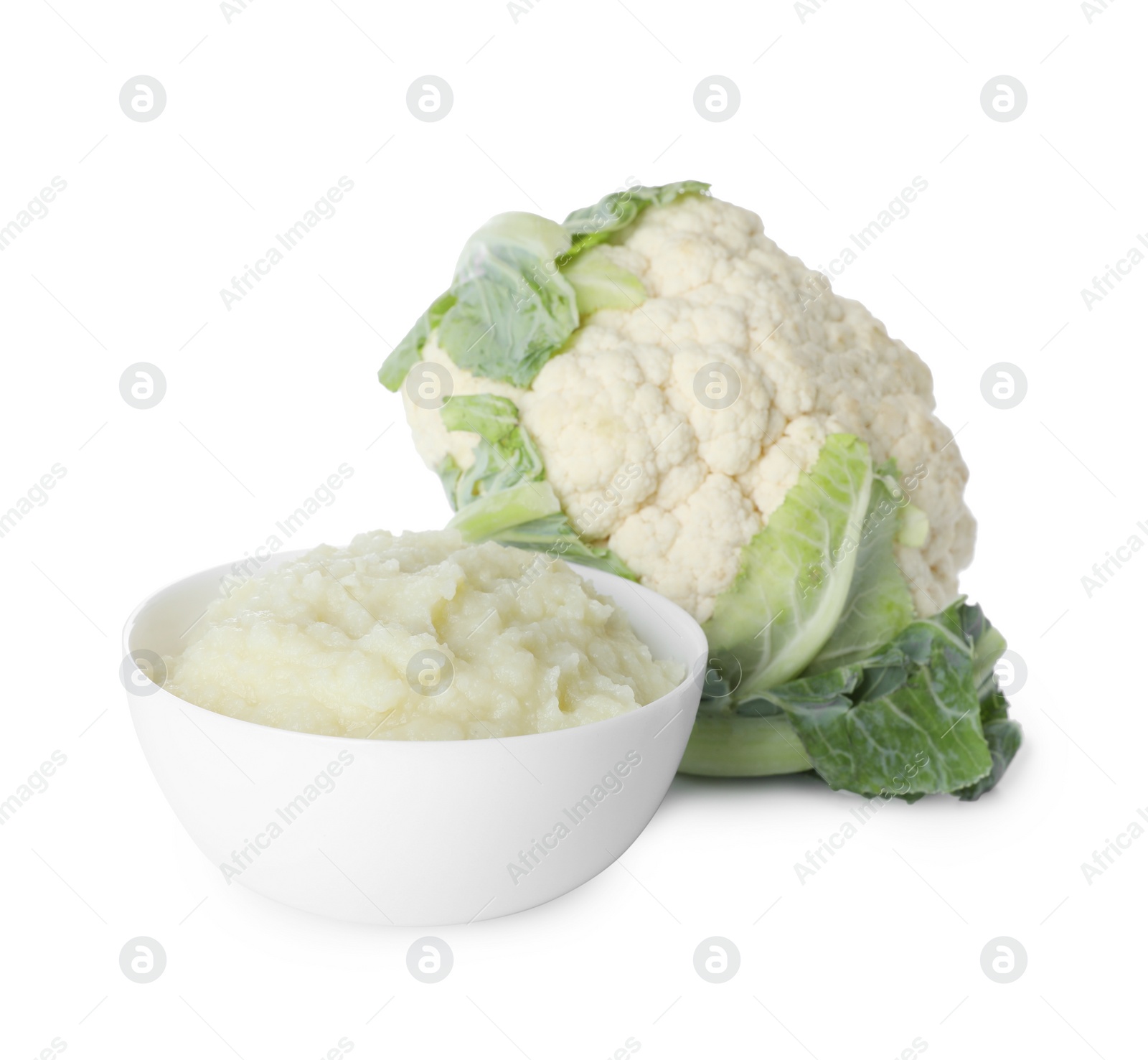 Photo of Bowl with tasty cauliflower puree on white background