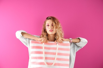 Photo of Beautiful young woman posing on color background. Summer fashion