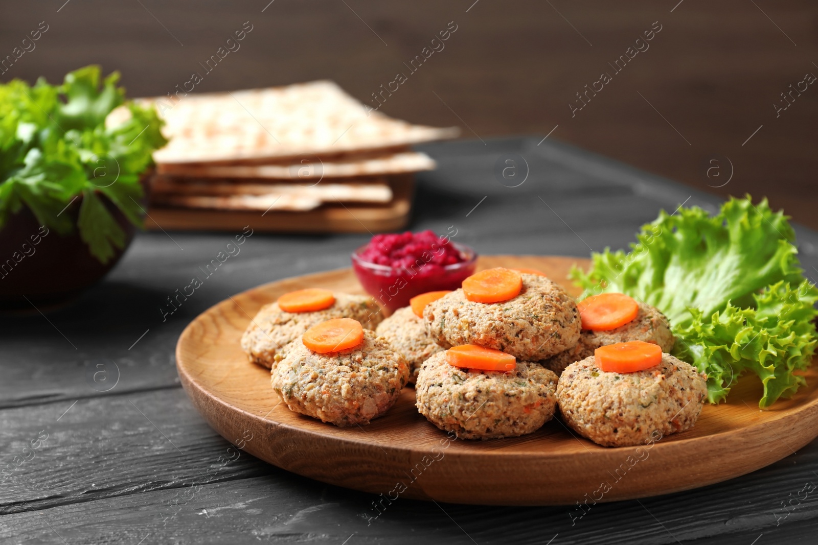 Photo of Plate of traditional Passover (Pesach) gefilte fish on wooden table