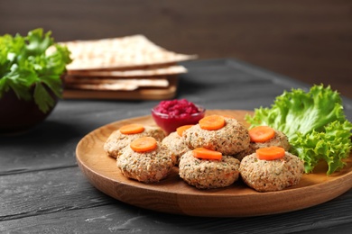 Photo of Plate of traditional Passover (Pesach) gefilte fish on wooden table