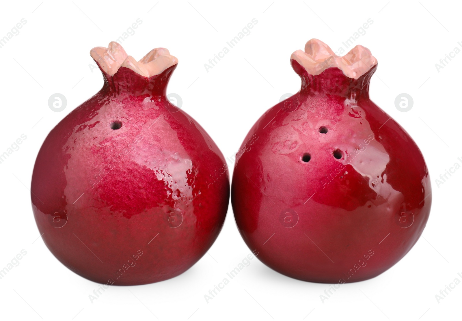 Photo of Pomegranate shaped salt and pepper shakers isolated on white