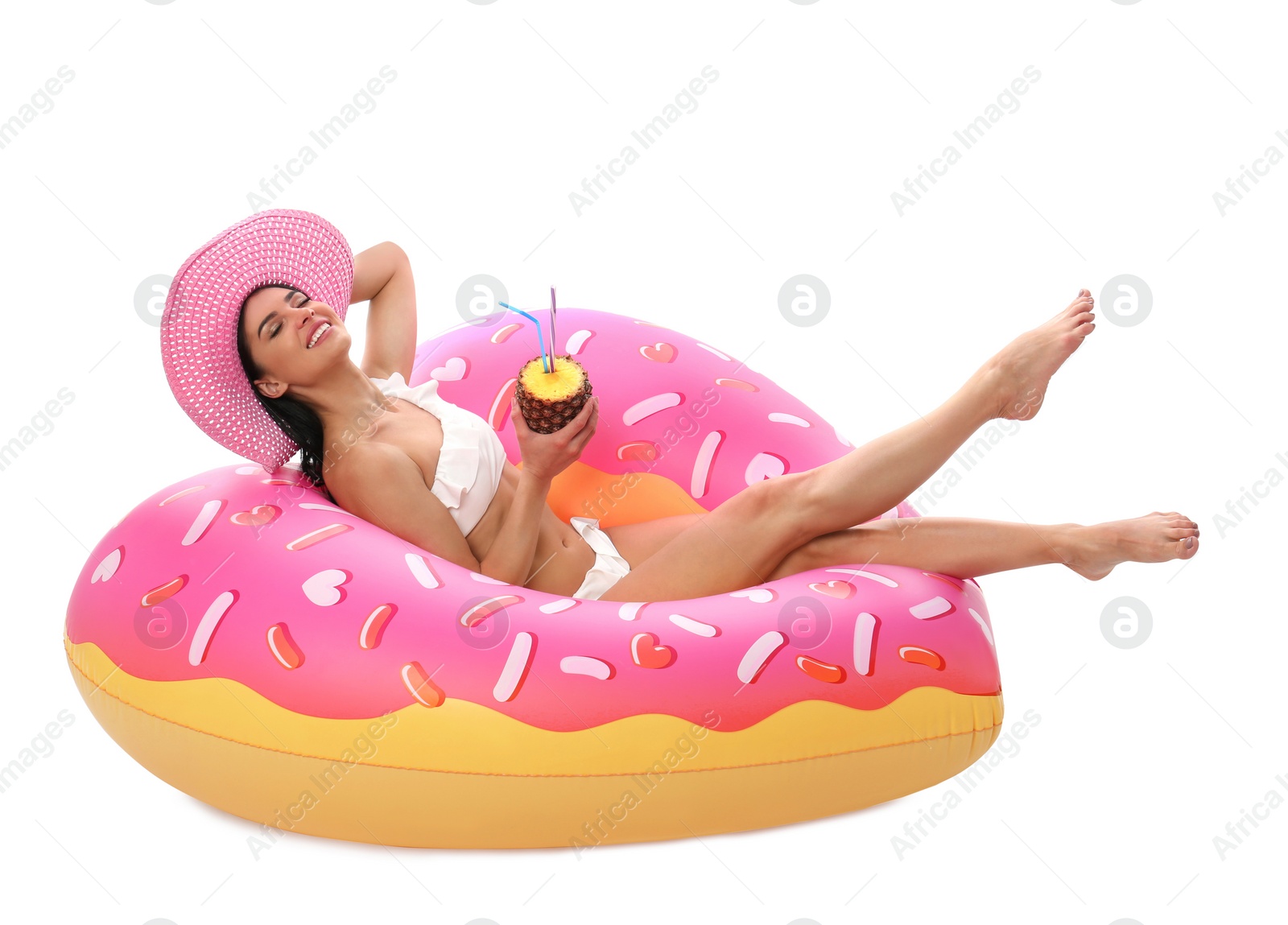 Photo of Beautiful young woman in stylish bikini with cocktail and inflatable ring on white background