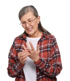 Senior woman suffering from pain in finger on white background