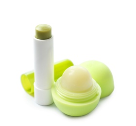 Photo of Hygienic lipstick and balm on white background