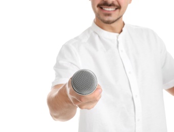 Young man holding microphone on white background, closeup with space for text