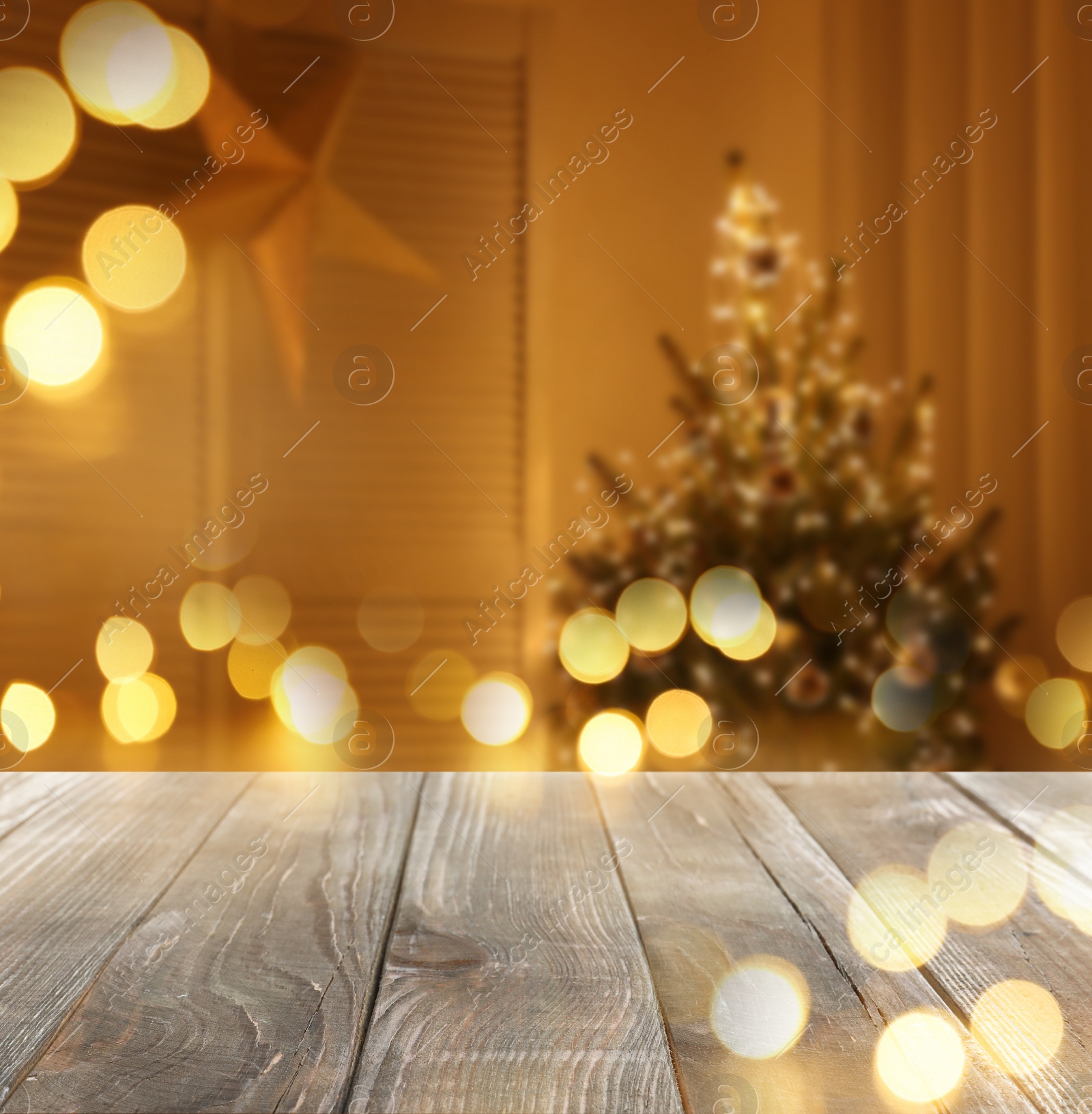 Image of Empty wooden surface and blurred view of room decorated for Christmas, space for text. Interior design