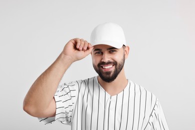 Photo of Man in stylish baseball cap on white background