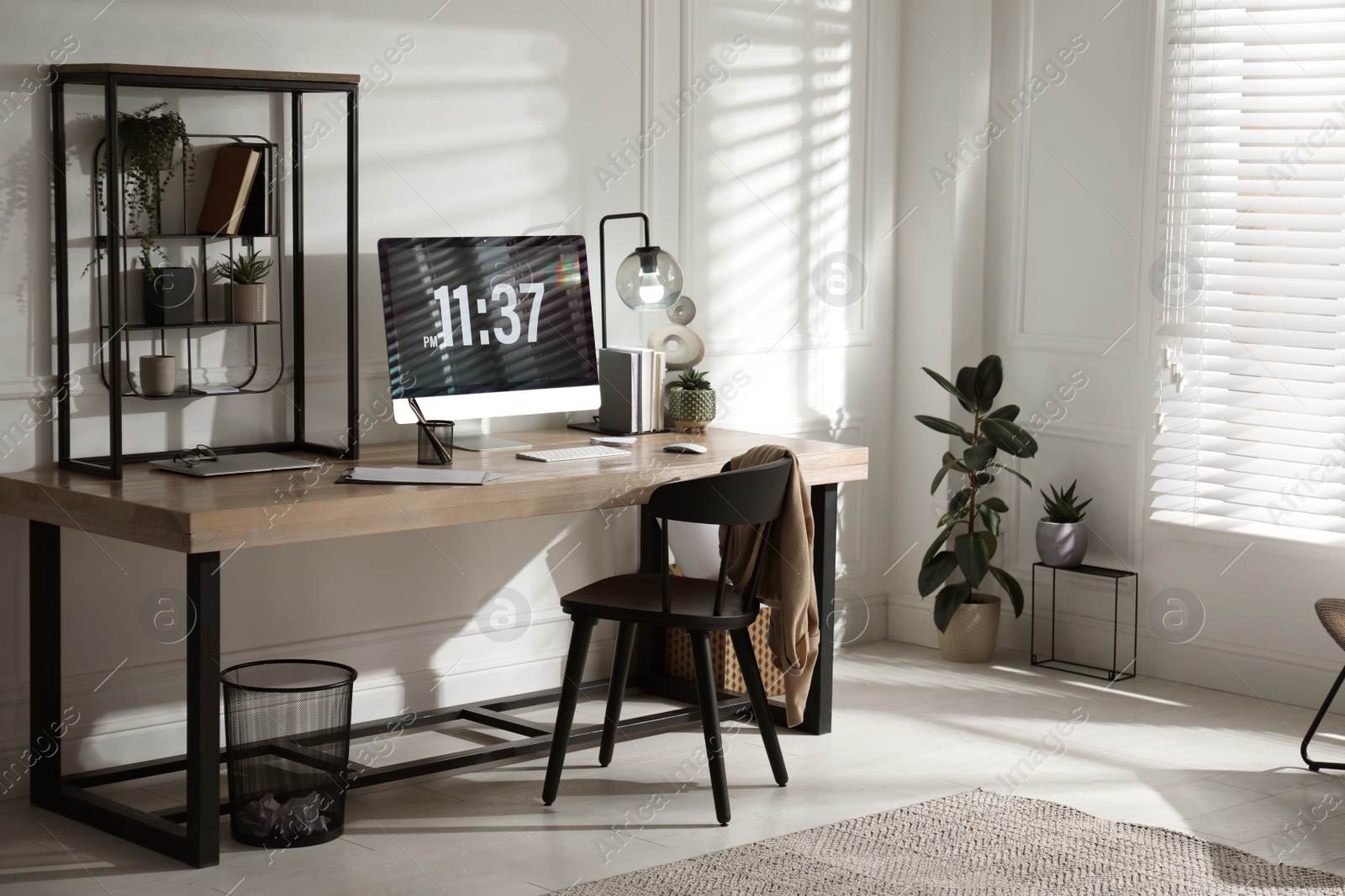 Photo of Room interior with comfortable workplace. Modern computer on wooden desk