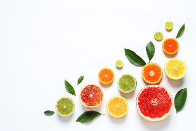 Flat lay composition with different citrus fruits on white background