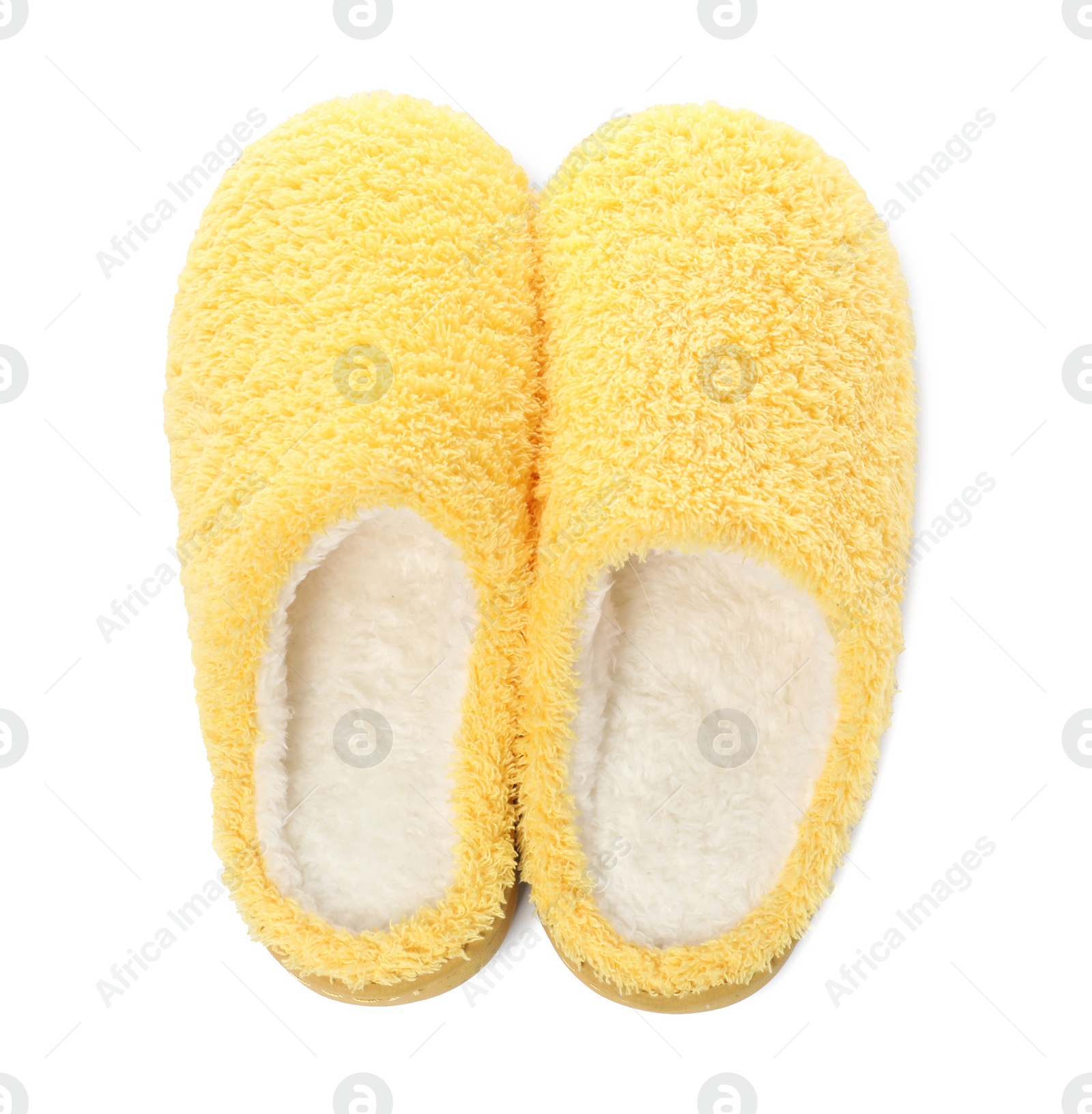 Photo of Pair of yellow soft slippers isolated on white, top view