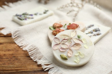 Photo of Scented sachets on wooden table, closeup. Space for text