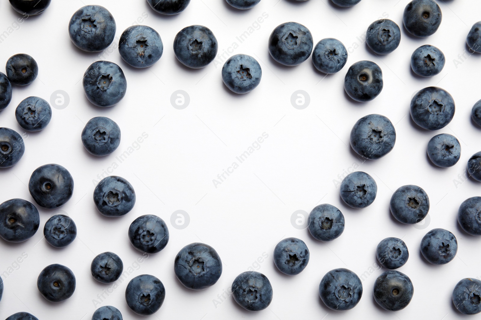 Photo of Flat lay composition with tasty blueberry and space for text on white background