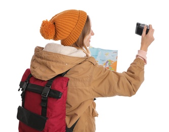 Photo of Woman with map and backpack taking picture on white background. Winter travel