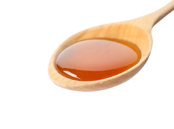 Photo of Spoon with delicious honey on white background