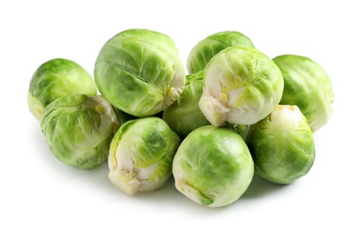 Photo of Pile of fresh Brussels sprouts on white background