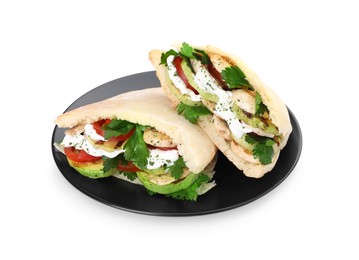 Plate of delicious pita sandwiches with grilled vegetables and sour cream sauce isolated on white