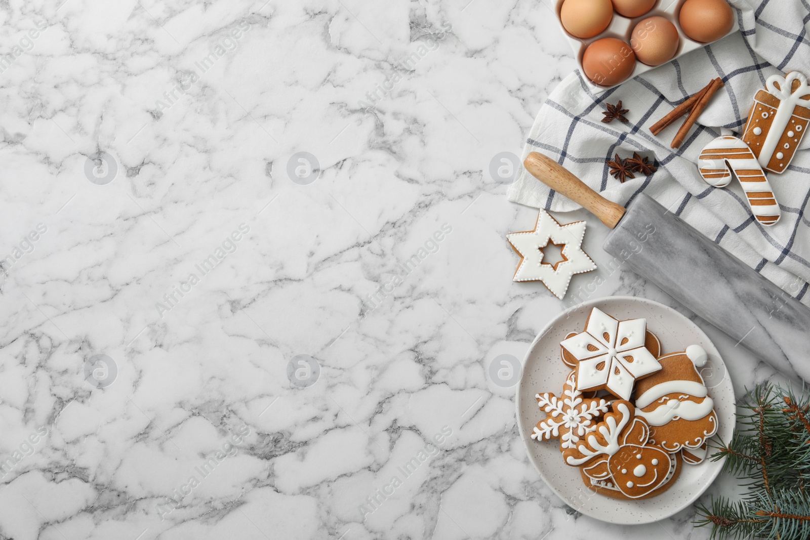 Photo of Flat lay composition with delicious homemade Christmas cookies on white marble table. Space for text