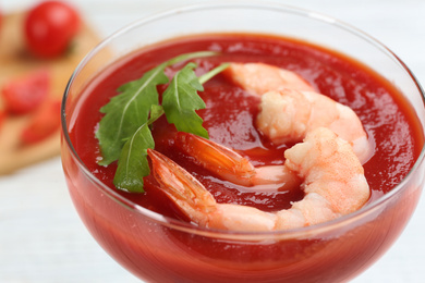 Photo of Delicious shrimp cocktail with tomato sauce, closeup