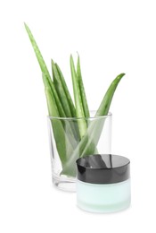 Photo of Jar of natural gel and fresh aloe isolated on white