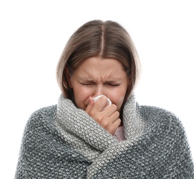 Photo of Young woman wrapped in warm blanket suffering from cold on white background