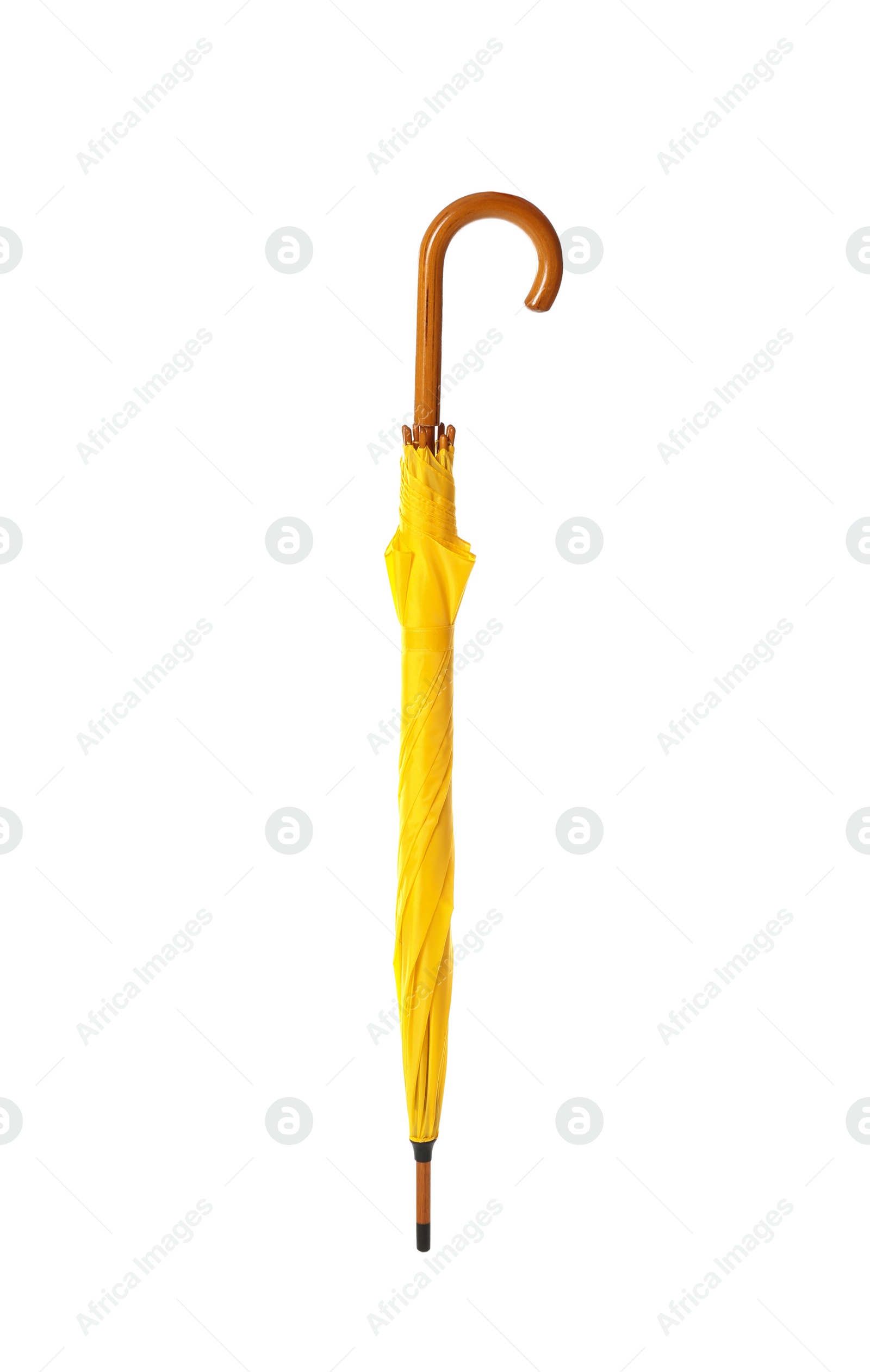 Photo of Modern closed yellow umbrella isolated on white